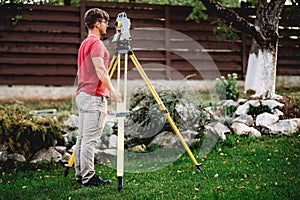 surveyor engineer working with total station theodolite and gps system