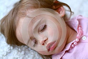 Portrait of sweet 2 year old girl sleeping