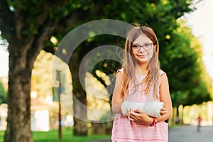 portrait of sweet little girl with a cast