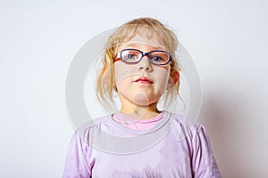 Portrait of sweet little girl with glasses