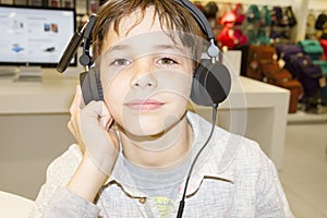 Portrait of a sweet young boy listening to music