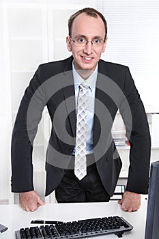 Portrait of a sympathetic manager in his office photo