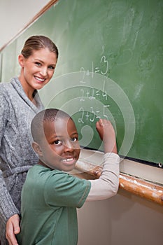 Portrait of a teacher explaining mathematics to a pupil
