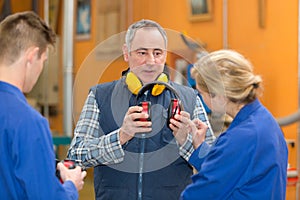 Portrait teacher putting ear-protection