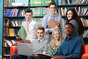 Portrait Of Teacher With Students In Library