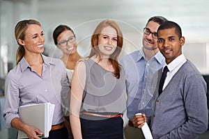 Portrait, team and happy business woman in office with support of people in company together. Face, coworking and