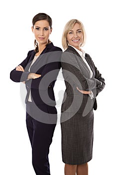 Portrait: Team of two isolated smiling and successful businesswoman in business outfit.