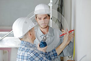 Portrait technician before drilling wall