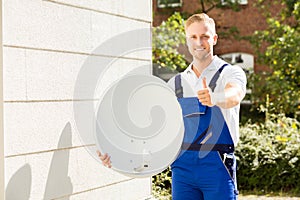 Portrait Of A Technician With TV Satellite Dish