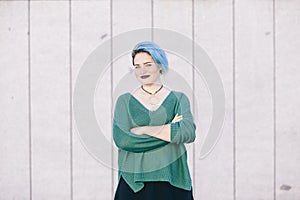Portrait of a teen androgynous woman with blue dyed hair isolate photo