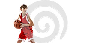 Portrait of teen boy, motivated sportsman training, playing basketball isolated over white studio background. Flyer
