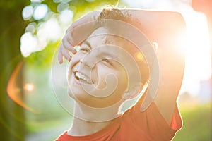 Portrait of teen boy with sun rays