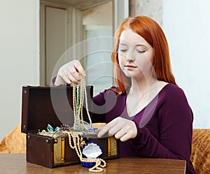 Portrait of teen girl chooses jewelry