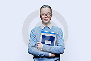 Portrait of teen girl high school student on white studio background