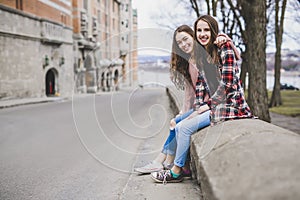 A Portrait of a teen girl with long hair in an urban