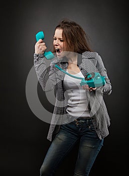 Portrait of the teen girl with old phone