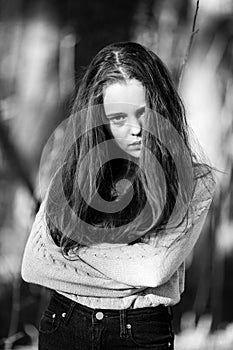 Portrait of a teen girl outdoor. Black and white photo.