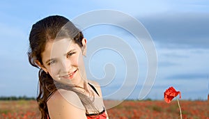 Portrait teen girl with poppy