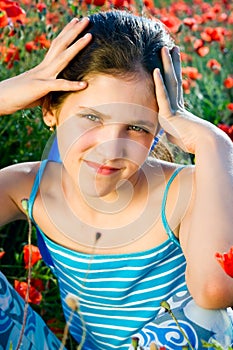 Portrait teen girl with poppy