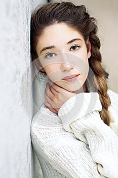 Portrait of a teen girl sad green eyes looking at the camera