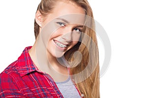 Portrait of teen girl showing dental braces.