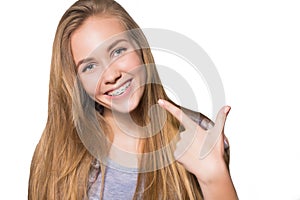 Portrait of teen girl showing dental braces.