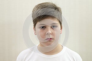 Portrait of teenage boy on the background light photo