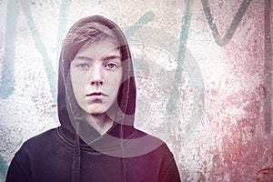 Portrait of a teenage boy with black hoodie