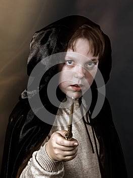 Portrait of teenage boy dressed in wizard costume