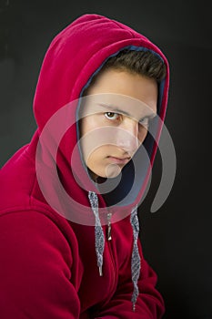 Portrait of teenage boy with a hood photo