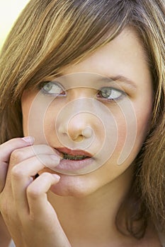 Portrait Of Teenage Girl Biting Nails