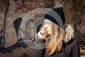 Portrait of a teenage girl in black hat