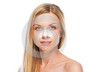 Portrait of teenage girl with clear-up strips on nose