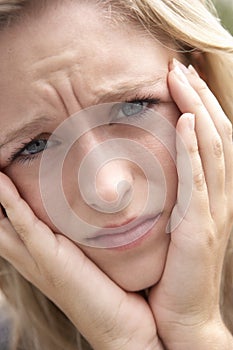 Portrait Of Teenage Girl Frowning