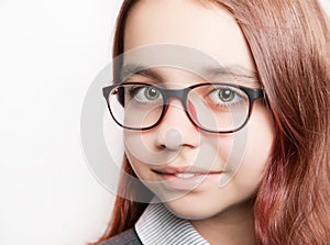 Portrait of teenage girl with glasses close-up.