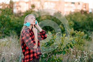 Portrait of a teenage girl listening to music on headphones