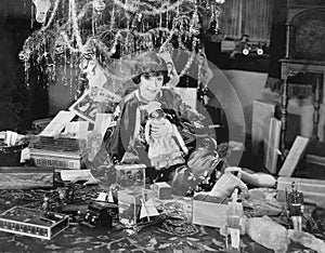 Portrait of teenage girl with opened Christmas presents