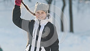 Portrait teenage girl with pigtailed wearing winter clothes in winter outside