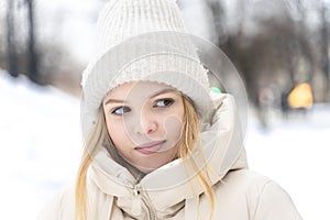 Portrait of a teenage girl in winter warm clothes