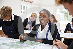 Portrait Of Teenage Students Studying Together In Art Class