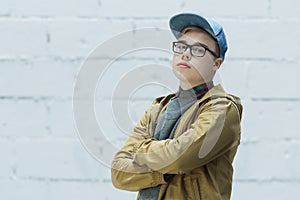 Portrait of teenage wearing cotton blue baseball cap and looking at camera