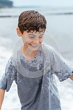 Portrait of teenager on the beach. Family vacation by the sea. Active lifestyle