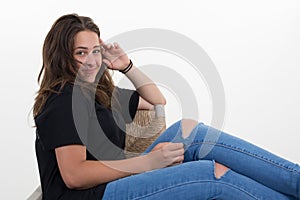 Portrait teenager girl young woman casual sitting portrait smile beautiful in studio over white background