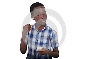 portrait of a teenager listening to music using wireless headphones
