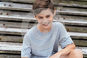 Portrait of teenager outdoors on blurred background