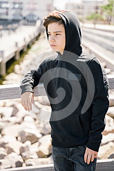Portrait of teenager outdoors on blurred background