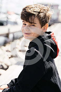 Portrait of teenager outdoors on blurred background