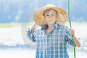 Portrait of teenager with twig fishing rod and