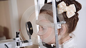 Portrait of a teenager who checks eyesight in a children`s clinic at a doctor