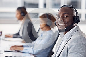 Portrait, telemarketing and black man with team, call center and customer service in workplace. Face, African American